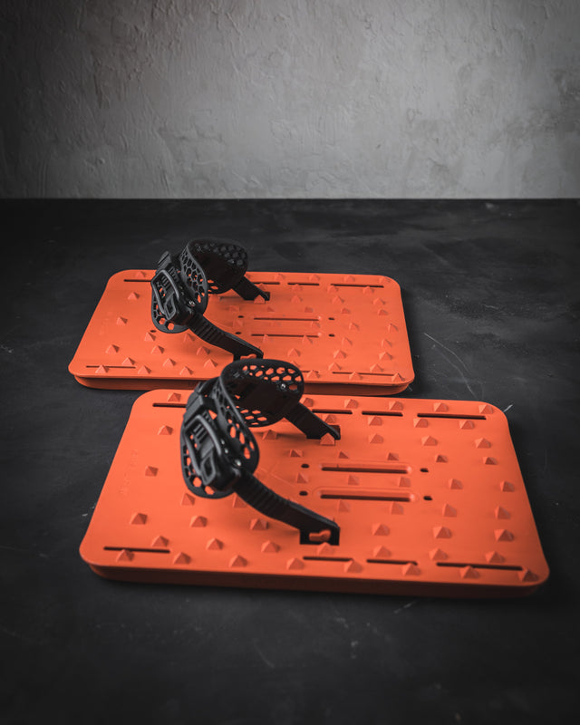 Two orange traction pads for powsurfing / snowwshoes